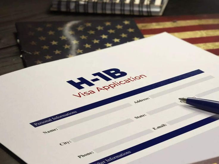 H-1B visa application form with U.S. flag – U.S. work visa process 2025