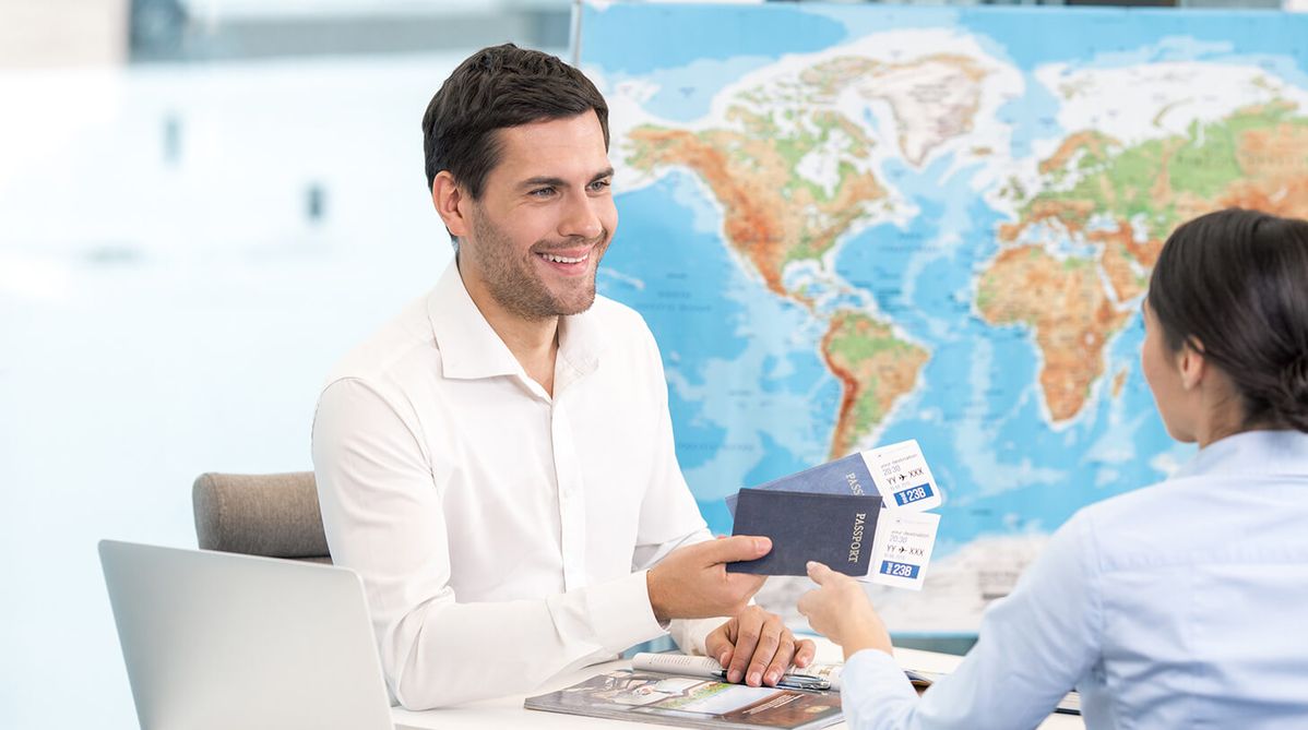 Immigration consultant reviewing passport and visa documents with an applicant during a professional consultation